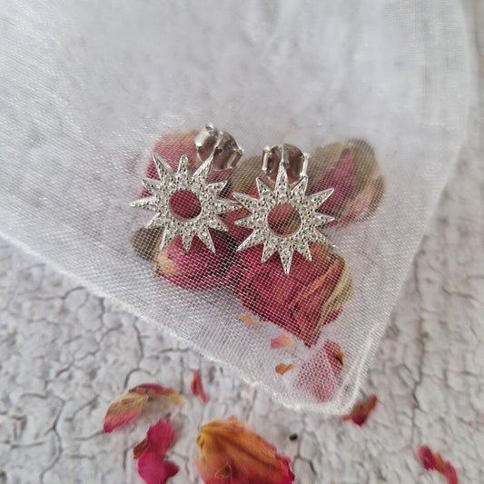 Silver starburst stud earrings, celestial earring, silver studs, cubic zirconia star earrings.